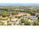 A picturesque community showcasing a pool, tennis courts, lake, and surrounding mature trees and landscaping at 5600 Buck Hollow Dr, Alpharetta, GA 30005