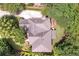 Aerial view of the home and property showcasing the roof and mature tree coverage at 5600 Buck Hollow Dr, Alpharetta, GA 30005