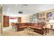 Relaxing basement area with large sectional sofa, media projector, and built-in bookshelves at 5600 Buck Hollow Dr, Alpharetta, GA 30005