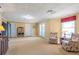 Spacious finished basement with sitting area, double doors, and neutral carpet at 5600 Buck Hollow Dr, Alpharetta, GA 30005
