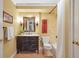 Cozy bathroom with decorative mirror, black vanity with marble countertop, and tub shower at 5600 Buck Hollow Dr, Alpharetta, GA 30005