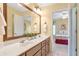 Bathroom featuring double sink vanity and doorway view to the connected bedroom at 5600 Buck Hollow Dr, Alpharetta, GA 30005
