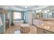 Bright bathroom with freestanding tub, glass enclosed shower, granite counters, and natural light at 5600 Buck Hollow Dr, Alpharetta, GA 30005