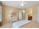 Bedroom with neutral walls and doorway view to ensuite bathroom at 5600 Buck Hollow Dr, Alpharetta, GA 30005