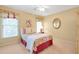 Bedroom with neutral walls and carpet, floral drapes, and light colored bedding at 5600 Buck Hollow Dr, Alpharetta, GA 30005