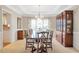 Elegant dining room featuring a large table, classic chandelier, and a built-in cabinet at 5600 Buck Hollow Dr, Alpharetta, GA 30005