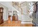 Inviting foyer with hardwood floors, staircase, and decorative details for a grand entrance at 5600 Buck Hollow Dr, Alpharetta, GA 30005
