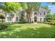 Stunning two-story home featuring a lush lawn and mature trees in a desirable neighborhood at 5600 Buck Hollow Dr, Alpharetta, GA 30005