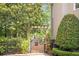 Charming gated garden entrance with mature landscaping, adding a touch of elegance at 5600 Buck Hollow Dr, Alpharetta, GA 30005