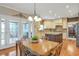 Elegant eat-in kitchen features granite counters, stainless appliances, and access to an outdoor deck at 5600 Buck Hollow Dr, Alpharetta, GA 30005