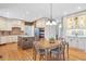 Well-appointed kitchen with an island, light-colored cabinets, and adjacent dining area at 5600 Buck Hollow Dr, Alpharetta, GA 30005