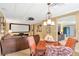 Entertainment room with large screen and ceiling-mounted projector; adjacent dining area at 5600 Buck Hollow Dr, Alpharetta, GA 30005