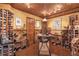Spacious wine cellar featuring extensive wooden wine racks, a tasting table, and a rustic aesthetic at 5600 Buck Hollow Dr, Alpharetta, GA 30005