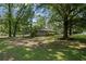 Expansive backyard with mature trees offering ample space for outdoor activities and privacy at 119 Walker Nw Rd, Cartersville, GA 30121