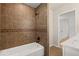 Renovated bathroom featuring tiled shower/tub and modern fixtures at 119 Walker Nw Rd, Cartersville, GA 30121