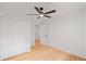 Bedroom with hardwood floors, fresh paint, a ceiling fan, and a closet offers a simple design at 119 Walker Nw Rd, Cartersville, GA 30121