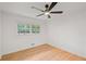 Sunlit bedroom featuring hardwood floors, a window with a view, and fresh paint at 119 Walker Nw Rd, Cartersville, GA 30121