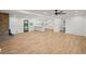 Expansive open-concept living area showcasing hardwood floors seamlessly flowing into the bright, modern kitchen at 119 Walker Nw Rd, Cartersville, GA 30121