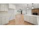 Open floor plan showcasing the living room with fireplace, hardwood floors, and natural light at 119 Walker Nw Rd, Cartersville, GA 30121