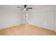 Spacious main bedroom featuring hardwood floors, ceiling fan, and closet space at 119 Walker Nw Rd, Cartersville, GA 30121