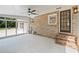 Enclosed sunroom boasts brick accent wall, neutral flooring and multiple windows at 119 Walker Nw Rd, Cartersville, GA 30121