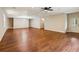 Large open basement with hardwood floors, recessed lights, ceiling fan, and access to the outside at 328 Shade Tree Cir, Woodstock, GA 30188