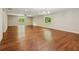 Spacious basement with hardwood floors, recessed lighting, and two large windows with green views at 328 Shade Tree Cir, Woodstock, GA 30188