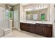 Bathroom features double vanity, shower and large mirrors at 328 Shade Tree Cir, Woodstock, GA 30188