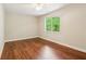 Bright bedroom with beautiful wood floors and ample natural light at 328 Shade Tree Cir, Woodstock, GA 30188