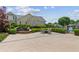 Charming courtyard with a fountain, lush landscaping, and outdoor seating for relaxing at 328 Shade Tree Cir, Woodstock, GA 30188