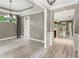 Spacious dining room with modern lighting, white trim and views into the backyard at 328 Shade Tree Cir, Woodstock, GA 30188