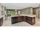 Open concept kitchen boasts granite countertops and stainless steel dishwasher at 328 Shade Tree Cir, Woodstock, GA 30188