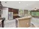 Modern kitchen with granite countertops, stainless steel appliances, an island and a breakfast bar at 328 Shade Tree Cir, Woodstock, GA 30188