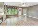 Inviting living room with a fireplace, built-in bookshelves and access to an outdoor space at 328 Shade Tree Cir, Woodstock, GA 30188