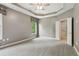 Spacious main bedroom features trey ceiling and ensuite bathroom at 328 Shade Tree Cir, Woodstock, GA 30188