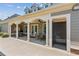 A covered patio area with seating, ceiling fans, and an outdoor shower offers a relaxing space at 328 Shade Tree Cir, Woodstock, GA 30188