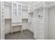 Spacious walk-in closet with custom storage solutions and carpeted flooring at 328 Shade Tree Cir, Woodstock, GA 30188
