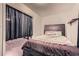 Bedroom featuring a dark bed frame and black out curtains at 4023 Stillwater Dr, Duluth, GA 30096