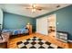 Bedroom with hardwood floors, checkered rug, closet and view to living room at 4023 Stillwater Dr, Duluth, GA 30096