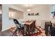 Comfortable dining area with natural light from the pass-through window to the living area at 4023 Stillwater Dr, Duluth, GA 30096