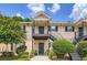 Inviting apartment building exterior with manicured landscaping and covered entries at 4023 Stillwater Dr, Duluth, GA 30096