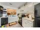 Well-lit kitchen with white cabinetry, modern appliances, and view into the dining area at 4023 Stillwater Dr, Duluth, GA 30096