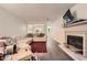 Bright living room featuring a fireplace and a seamless view into the kitchen at 4023 Stillwater Dr, Duluth, GA 30096