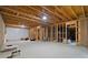 Large unfinished basement with exposed beams, ready to be transformed into your dream space at 4814 Little Cove Ct, Auburn, GA 30011