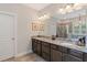 Spacious bathroom features dark cabinets, granite countertops, and a glass shower at 4814 Little Cove Ct, Auburn, GA 30011