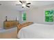 Spacious bedroom with a ceiling fan, neutral walls and ample natural light at 4814 Little Cove Ct, Auburn, GA 30011