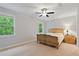 Bright bedroom with a ceiling fan, natural light and neutral walls at 4814 Little Cove Ct, Auburn, GA 30011