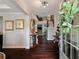 Elegant foyer with hardwood floors, staircase, decorative mirror and stylish furnishings at 4814 Little Cove Ct, Auburn, GA 30011