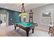 A second story game room with pool table, custom lighting, and bar seating for entertaining at 4814 Little Cove Ct, Auburn, GA 30011