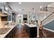 Spacious kitchen with an island, stainless appliances, and an open layout to the living area at 4814 Little Cove Ct, Auburn, GA 30011